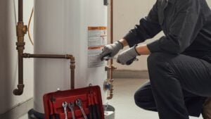 plumber diagnosing water heater no hot water